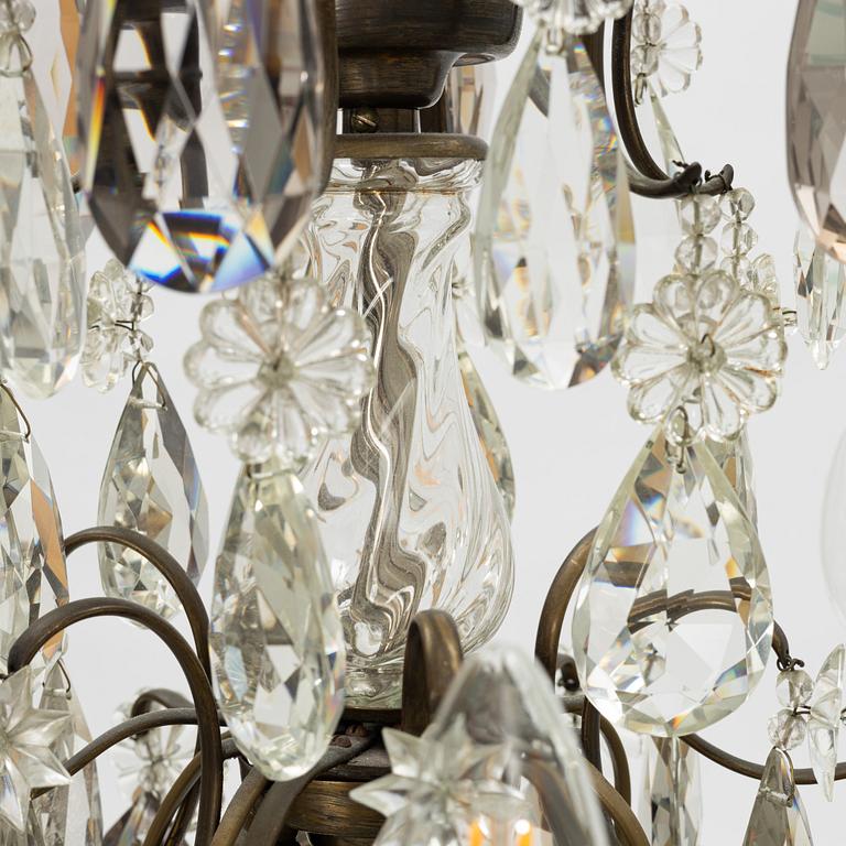 Takkrona, rokokostil, 1900-talets första hälft.