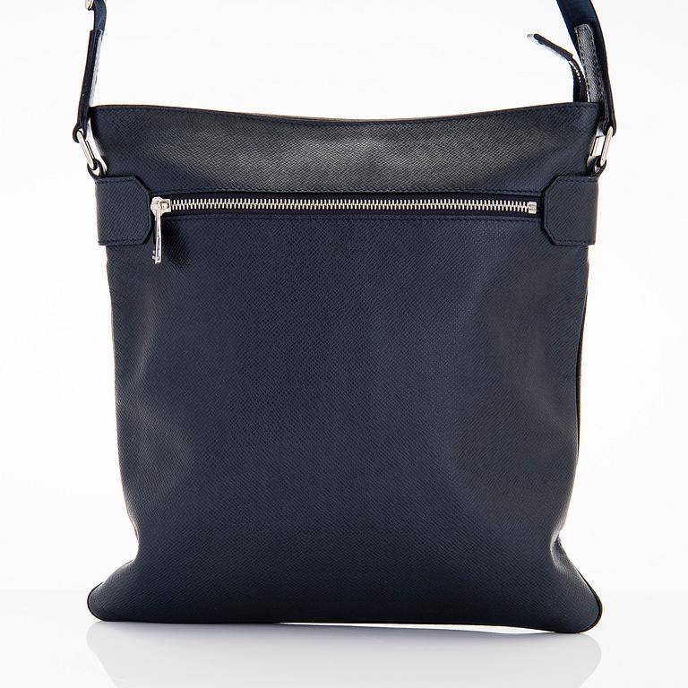 Louis Vuitton, a Navy Taiga 'Sasha' Messenger bag.