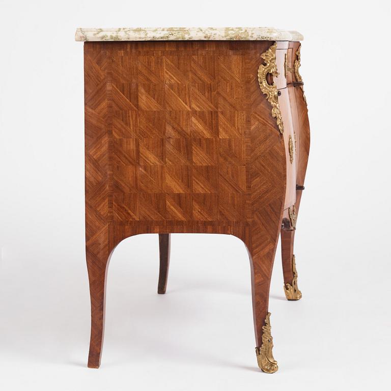 A Swedish rococo parquetry and ormolu-mounted commode, later part of the 18th century.