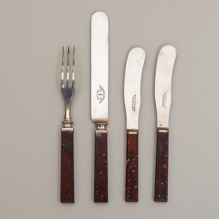 A set of four Swedish porphyry 19th century knives (3) and fork (1).