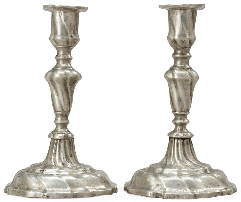 A pair of Rococo pewter candlesticks by Johan Anjou (Gävle 1763-1808/10).