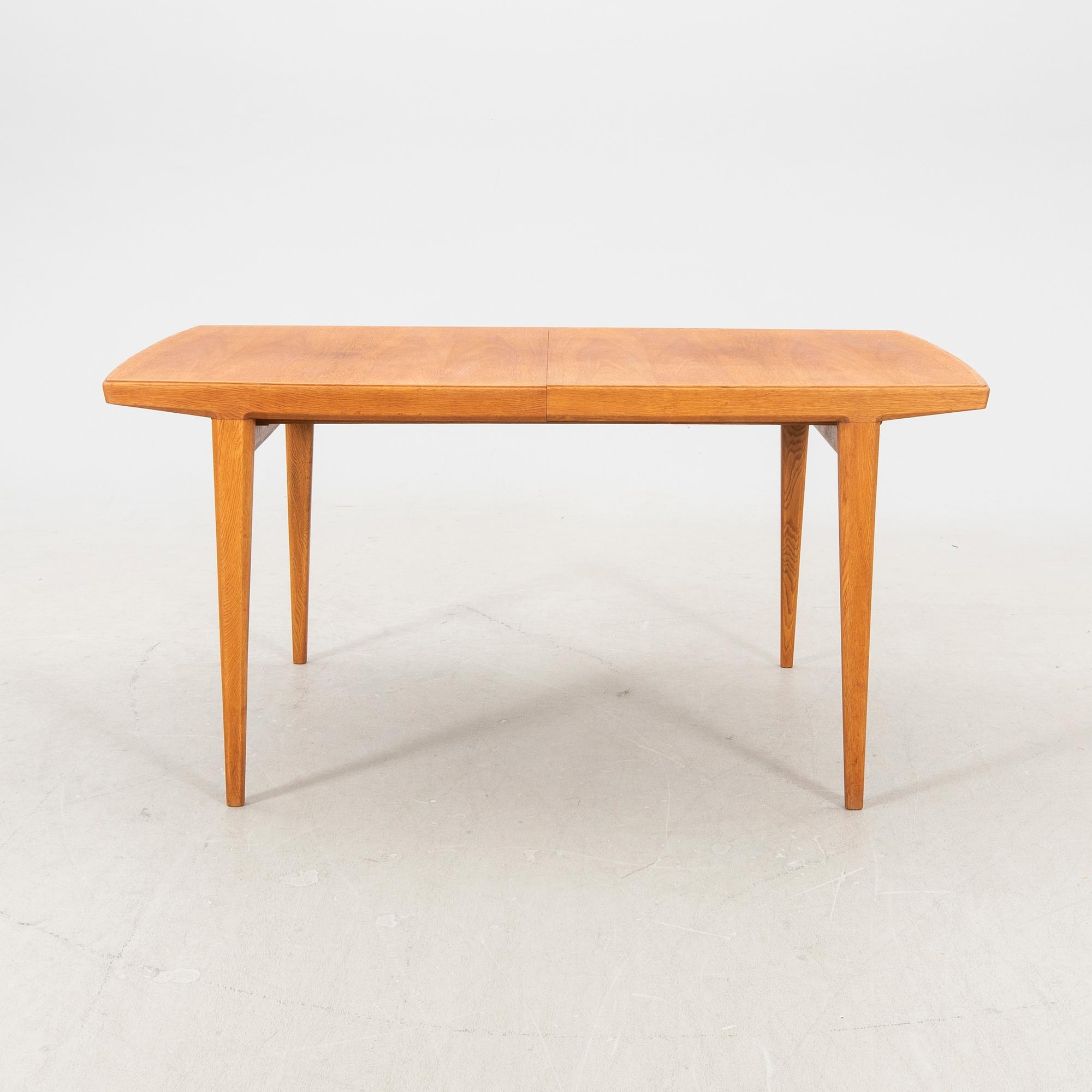 A 1950s teak dining table.