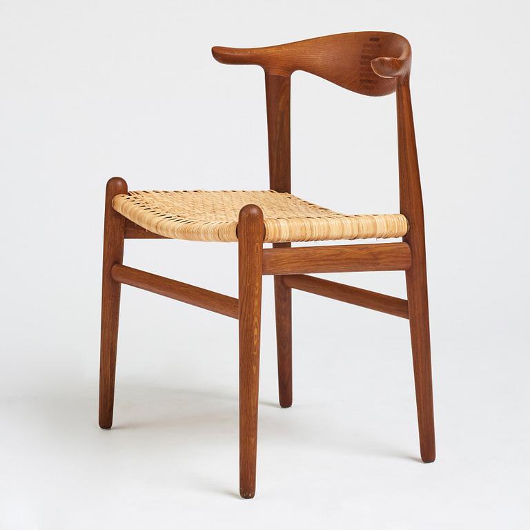 Hans J. Wegner, a teak, oak and cane "Cowhorn chair", JH 505, Johannes Hansen, Denmark 1950-60's.