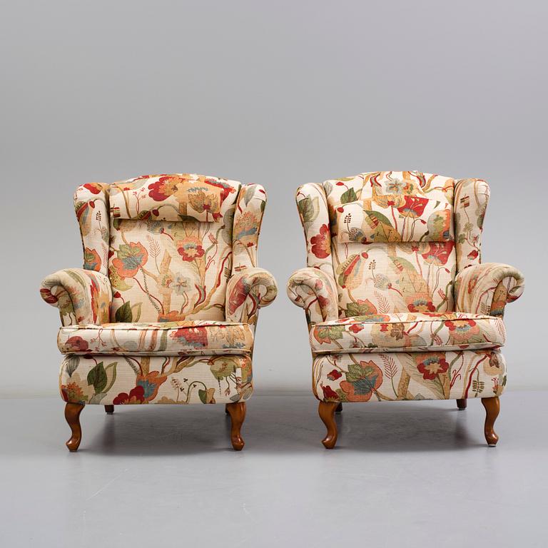 A pair of 20 th century arm chairs.