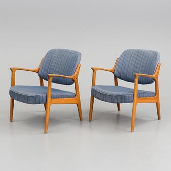 A pair of oak armchairs from Bröderna Andersson, mid 20th Century.