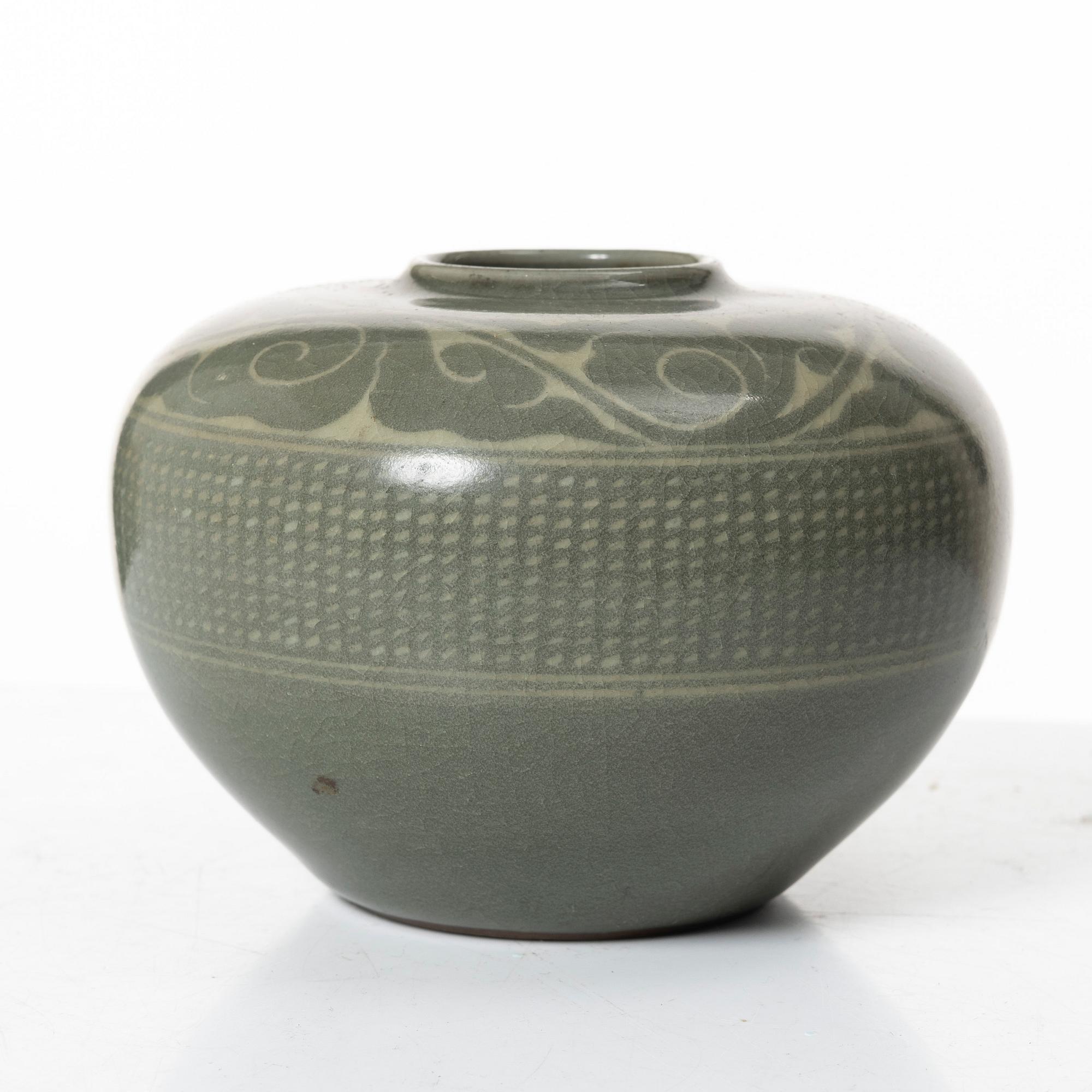 A Korean celadon glazed ceramic vase, 1900s.