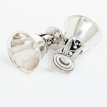 Evald Nielsen, four sterling silver beakers/cups on a foot, Denmark 20th century.