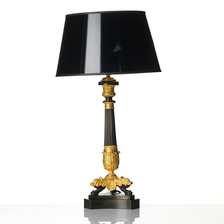 A French Louis Philippe ormolu and patinated bronze lamp, first part 19th century.