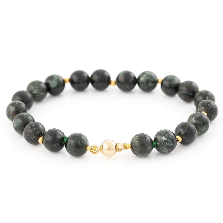 Bracelet, with dark green stones, clasp in 18K gold.