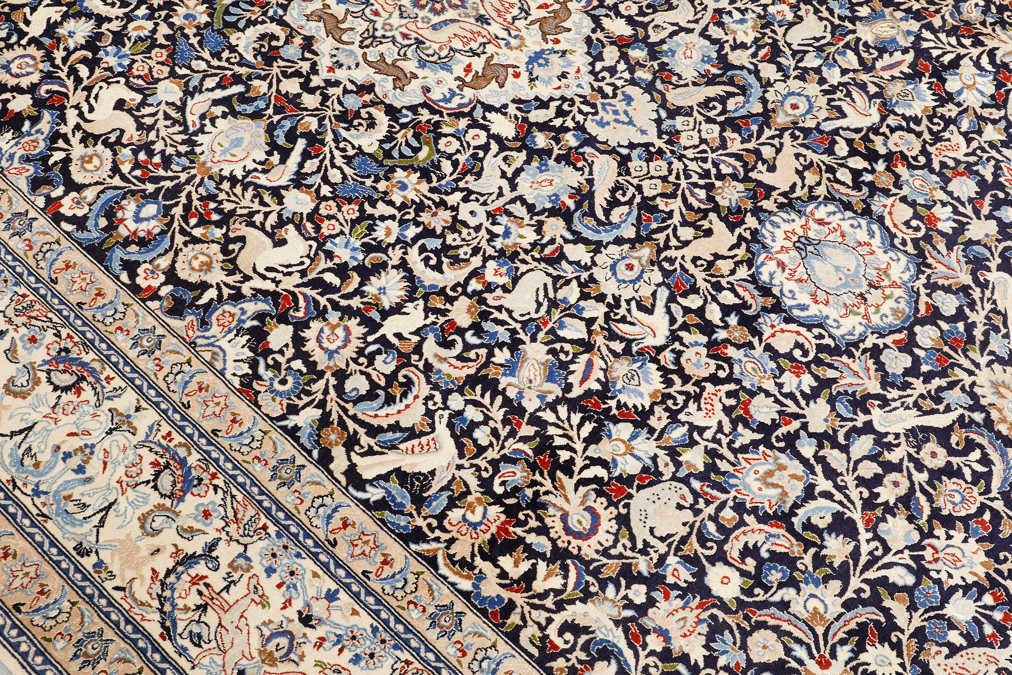 A Nain carpet, part silk, so-called 6 LAA, approx. 324 x 210 cm.