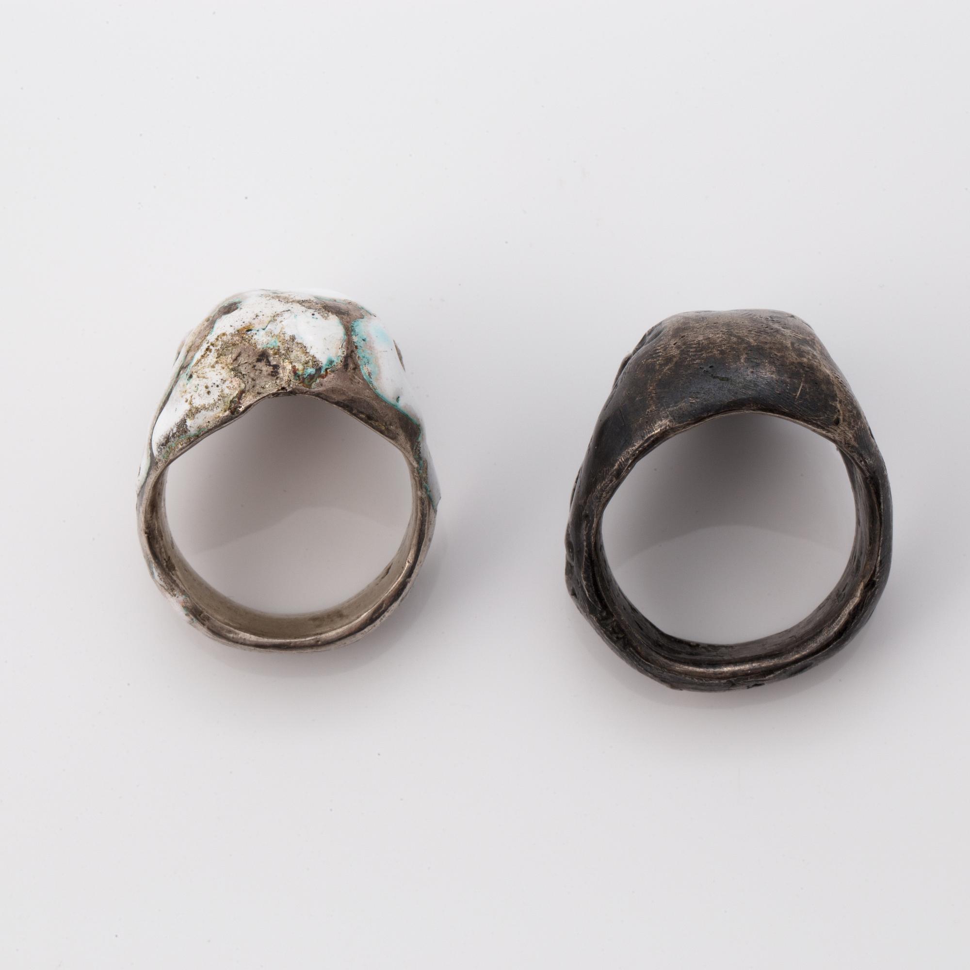 Six silver and enamel silver rings.