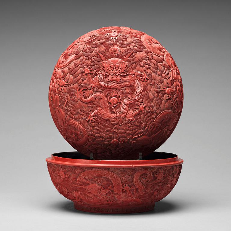 A carved red dragon box with cover, Qing dynasty (1662-1912).