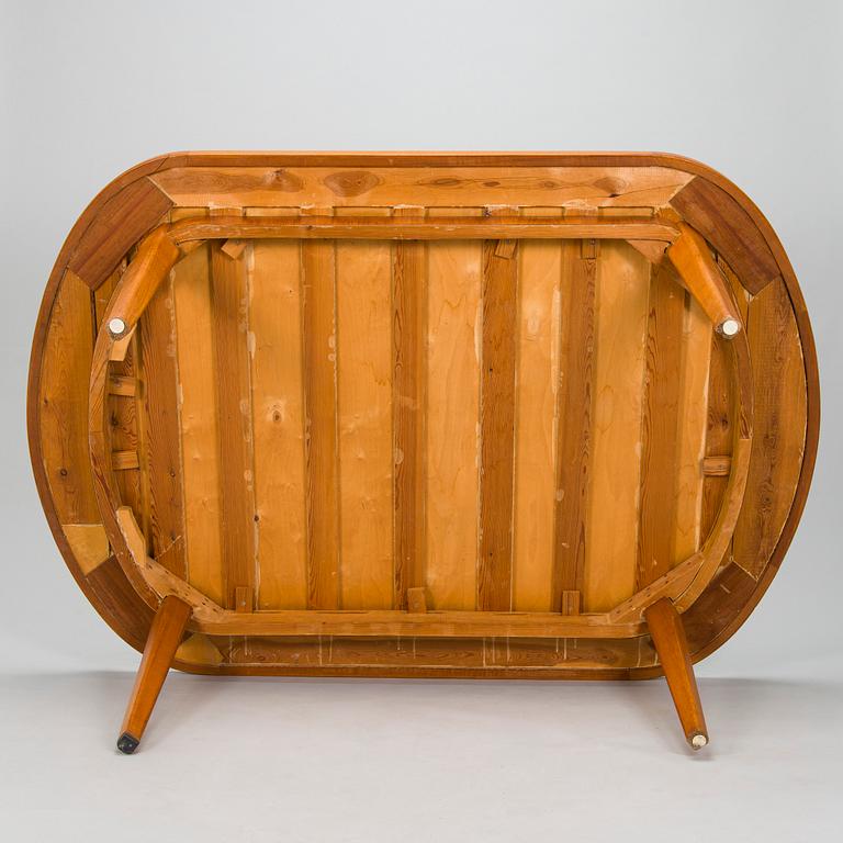 A mid-20th century dining table.