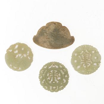 A group of four Chinese stone amulets / plaques, 20th century.