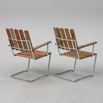 A pair of Grythyttan garden chairs.