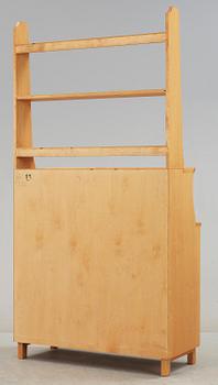 SKÅP MED HYLLA. Carl Malmsten, Åfors Möbelfabrik.