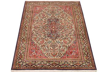 A Ghom rug, c. 202 x 137 cm.