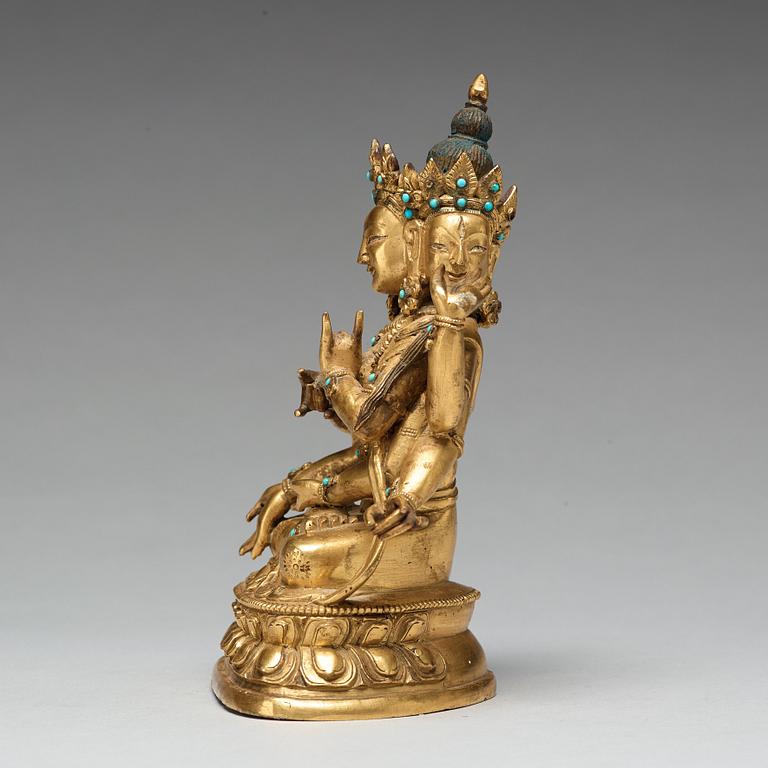 A Sino-Tibetan gilt copper alloy figure of Ushnisha Vinaya, late 18th century/circa 1800.