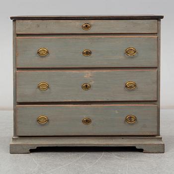 a chest of drawers from the first half of the 19th century.