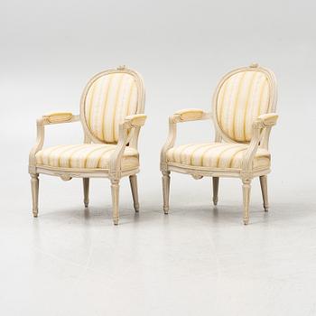 A pair of Gustavian style armchairs signed J.G.A, mid 20th century.