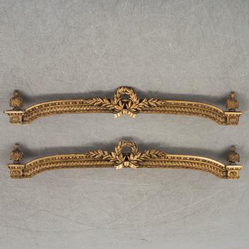 A pair of gilt Louis XVI style pelmets, circa 1900.