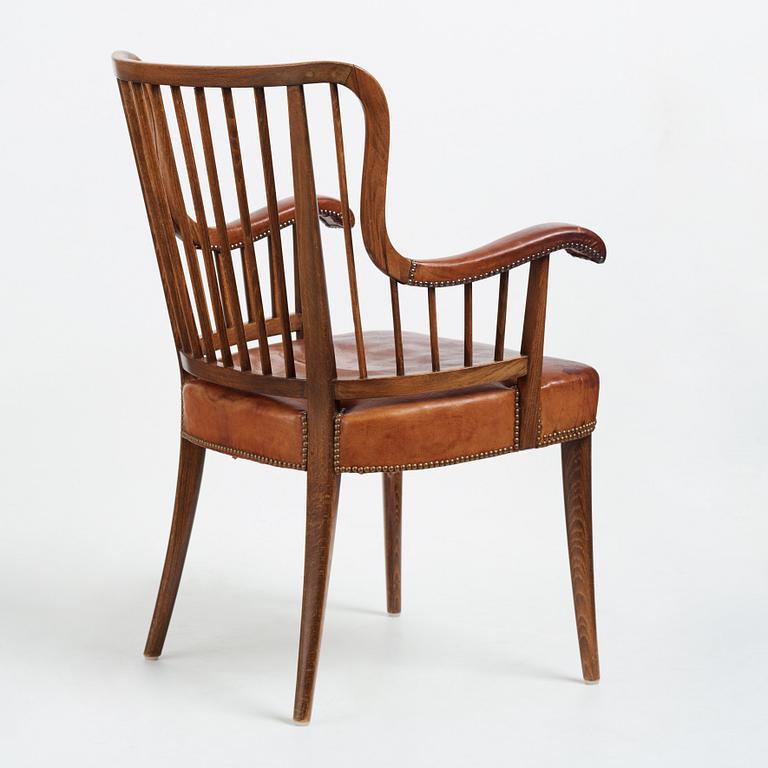 Otto Schulz, a Swedish Modern stained beech and cognac coloured leather armchair.