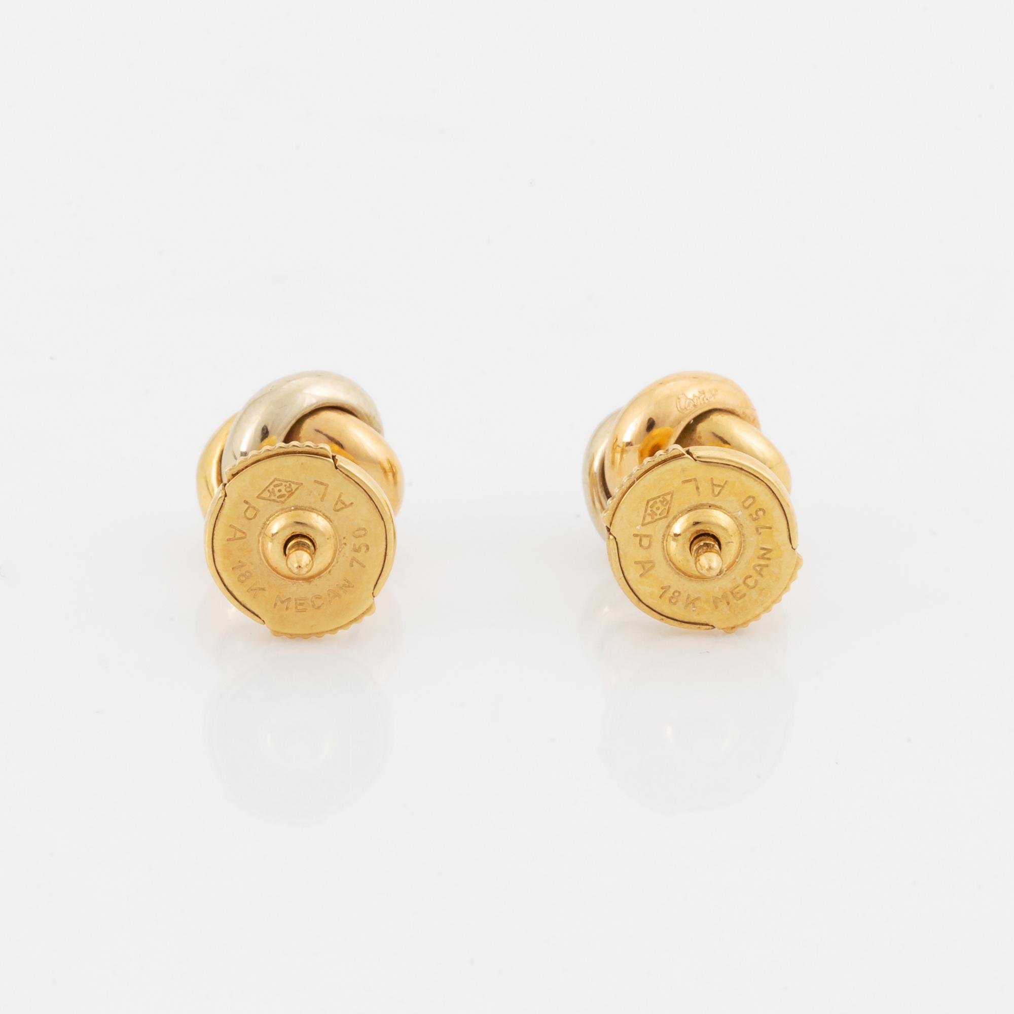 Ett par örhängen Cartier "Trinity" 18K guld med runda briljantslipade diamanter.