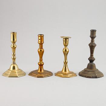 Four 18th century bronze candlesticks.