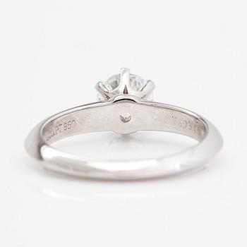 Tiffany & Co, A platinum ring with a 0.65 ct diamond.