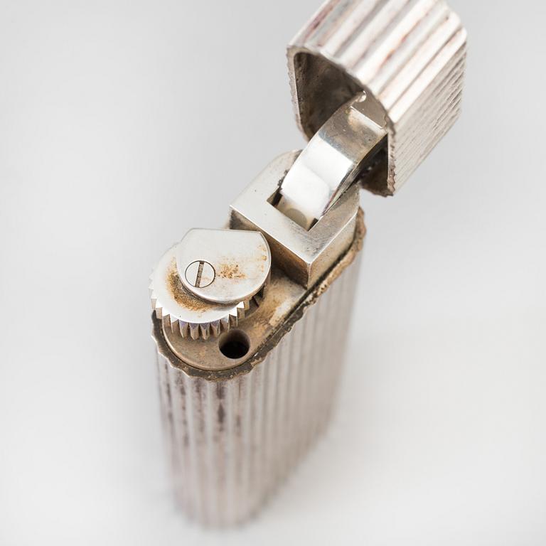 a 20th century Cartier lighter with original box from Paris.