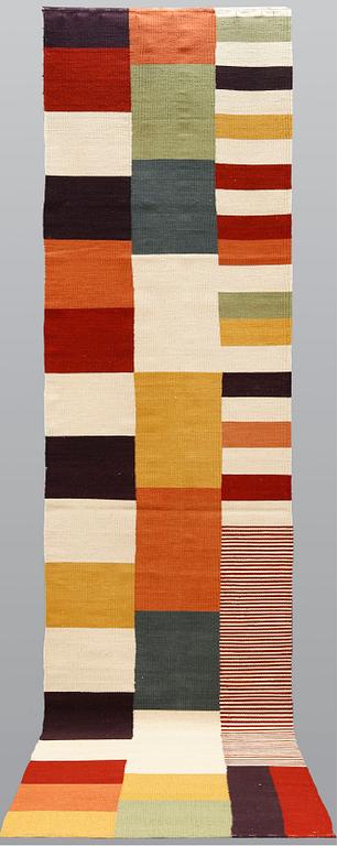 A runner, flat weave, ca 488 x 82 cm.