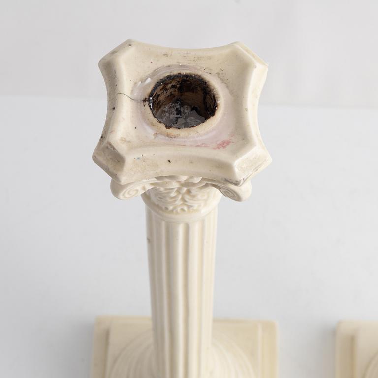 A pair of creamware candlesticks, around 1900.