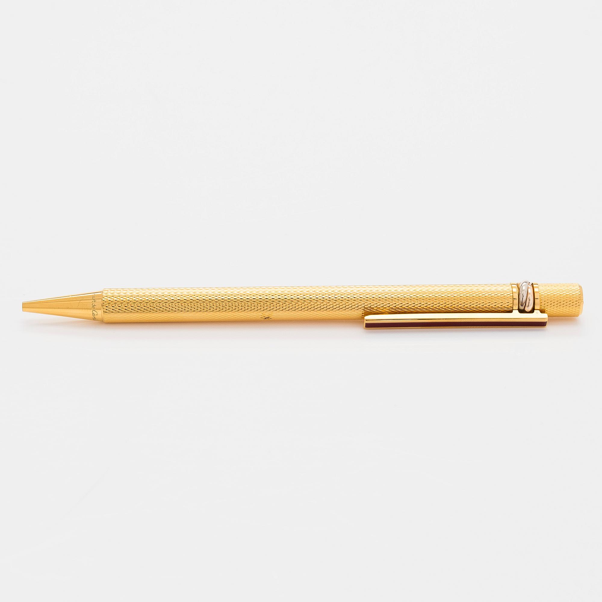 Cartier, must de Cartier, a "Trinity" ballpoint pen.