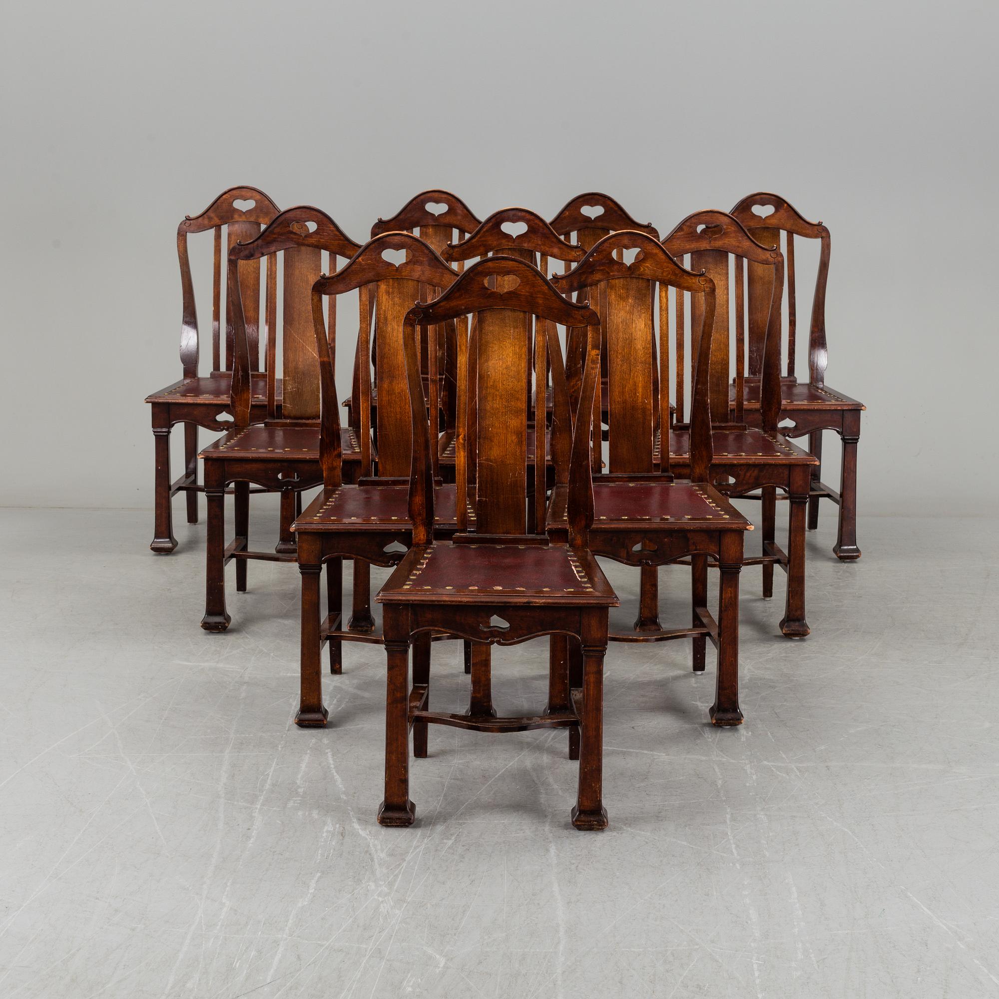 A late 19th century dining table with ten chairs and five extension leaves.