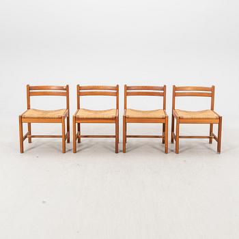 A set of four 1970s pine chairs.