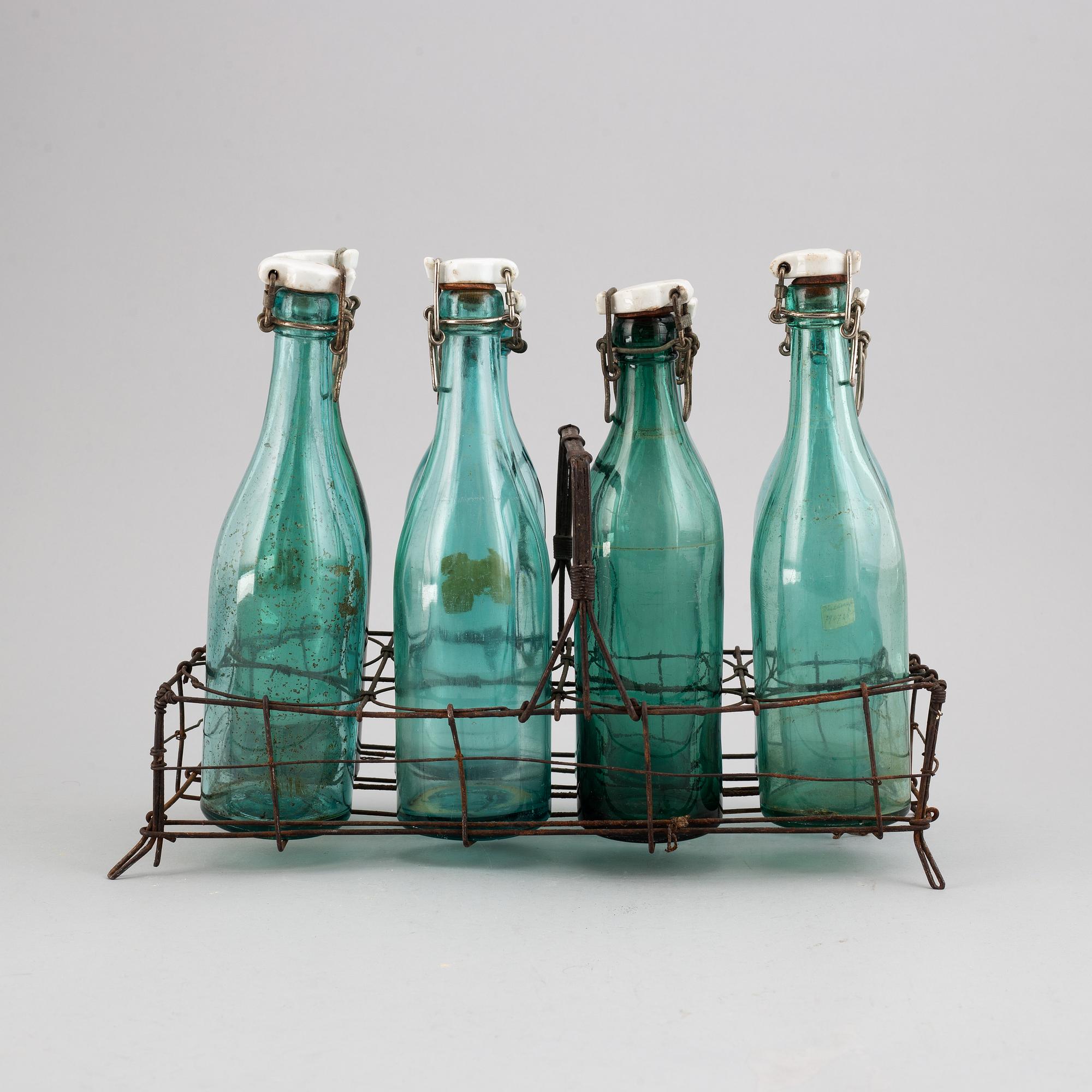 A metal bottle holder, first half of the 20th century.