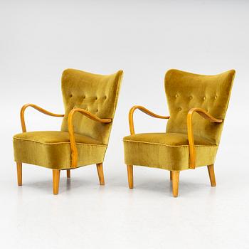 A pair of wingback armchairs, Sweden, first half of the 20th century.