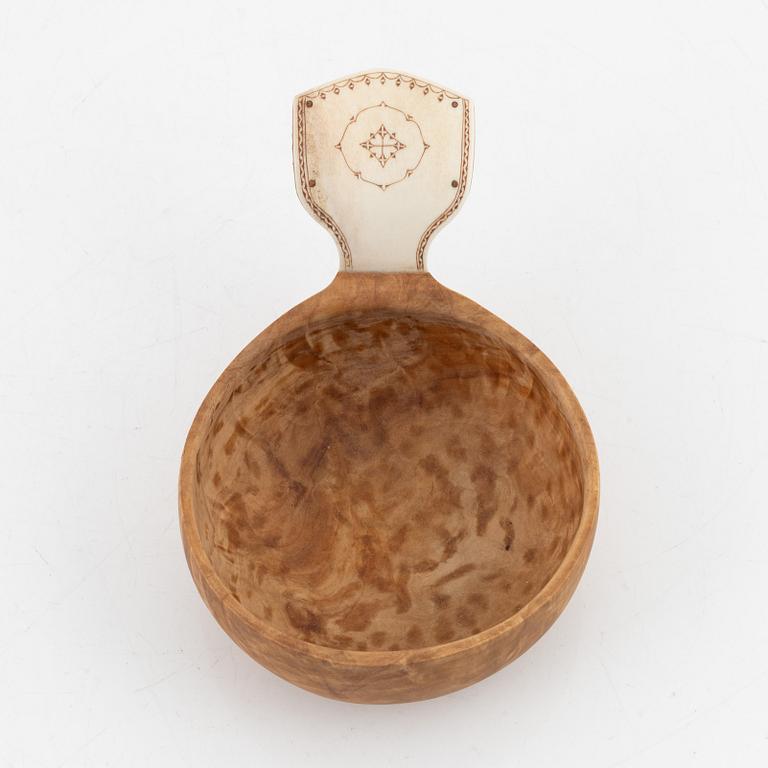 A birch cup, signed PS.