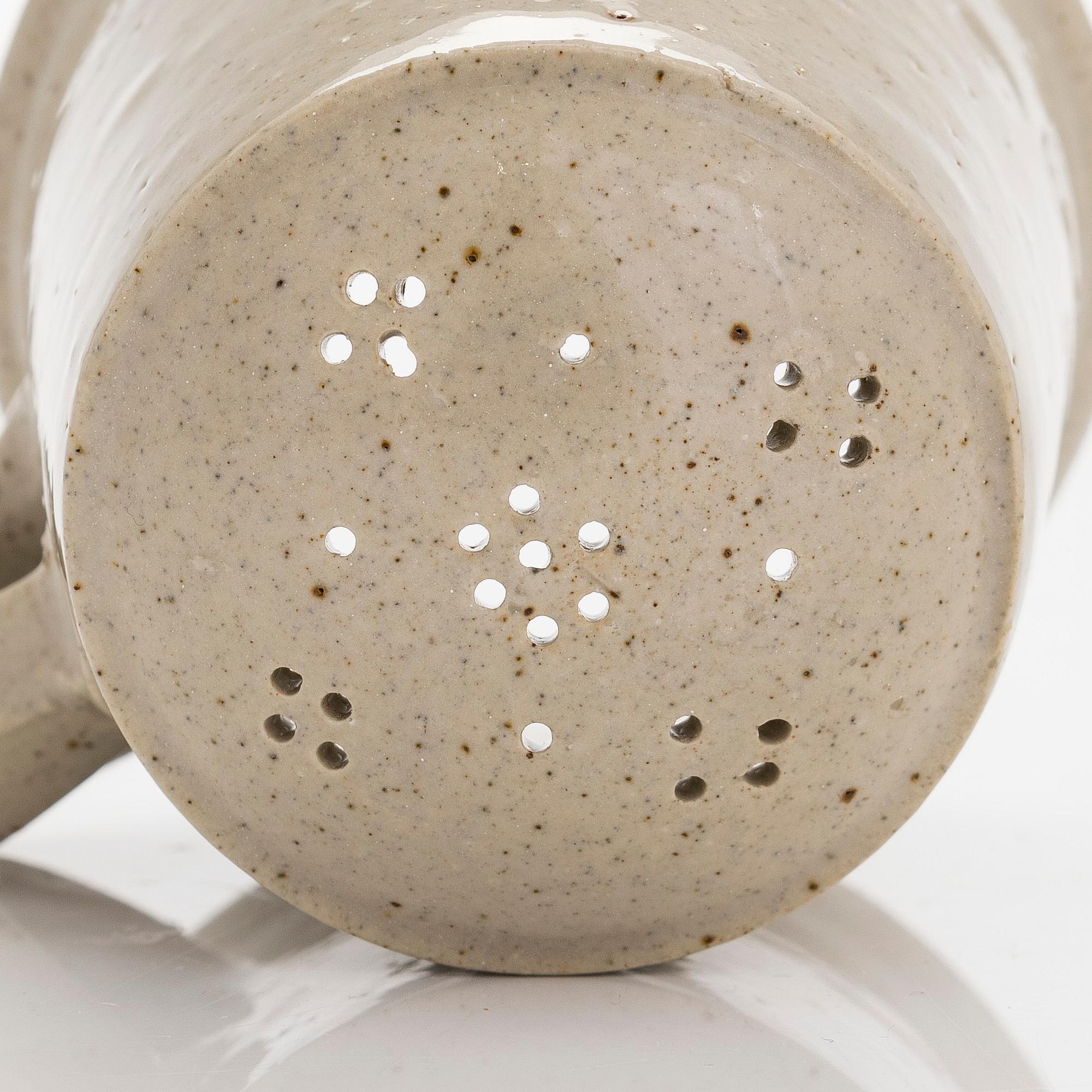 Kyllikki Salmenhaara, a stoneware tea strainer signed KS.