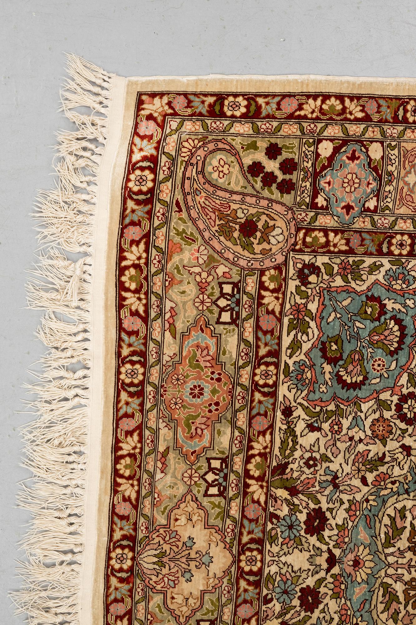 A rug, Old silk Hereke, ca 152 x 110 cm.