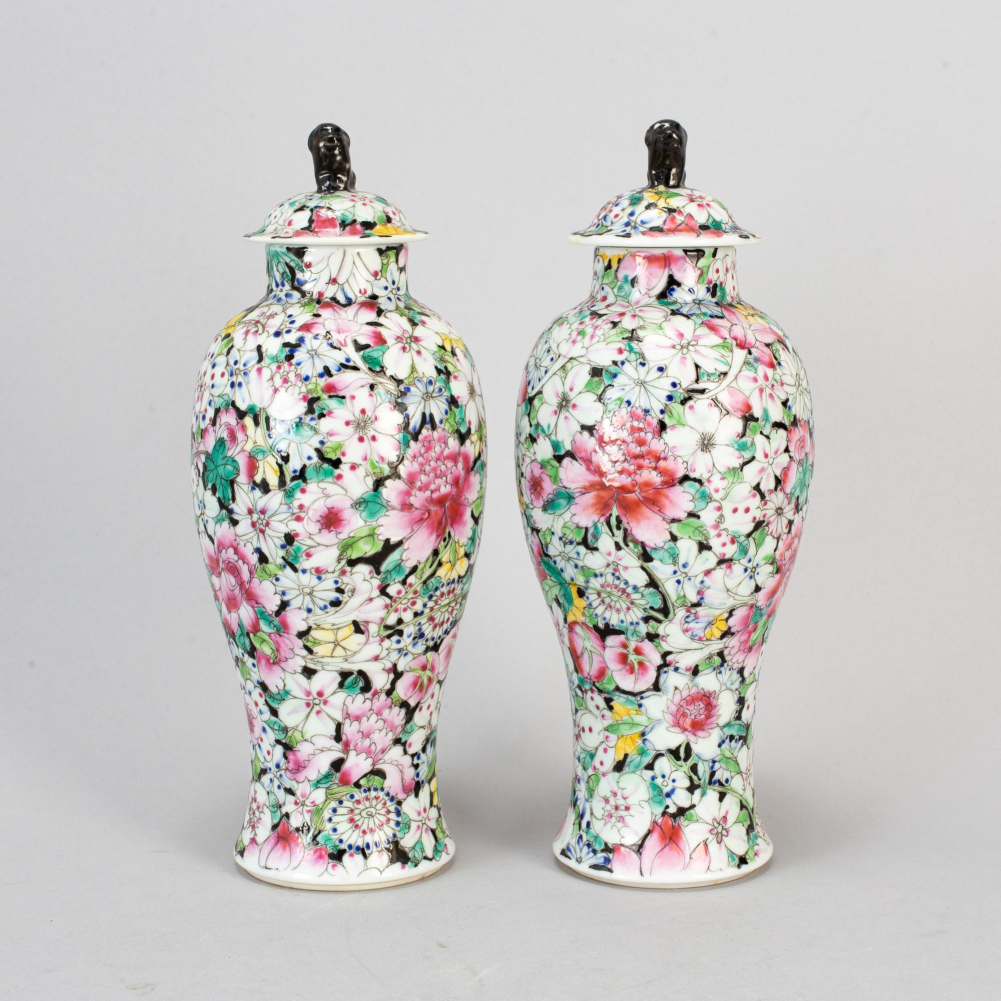 A pair of Chinese 'Mille fleur' porcelain vases with covers, 20th century.