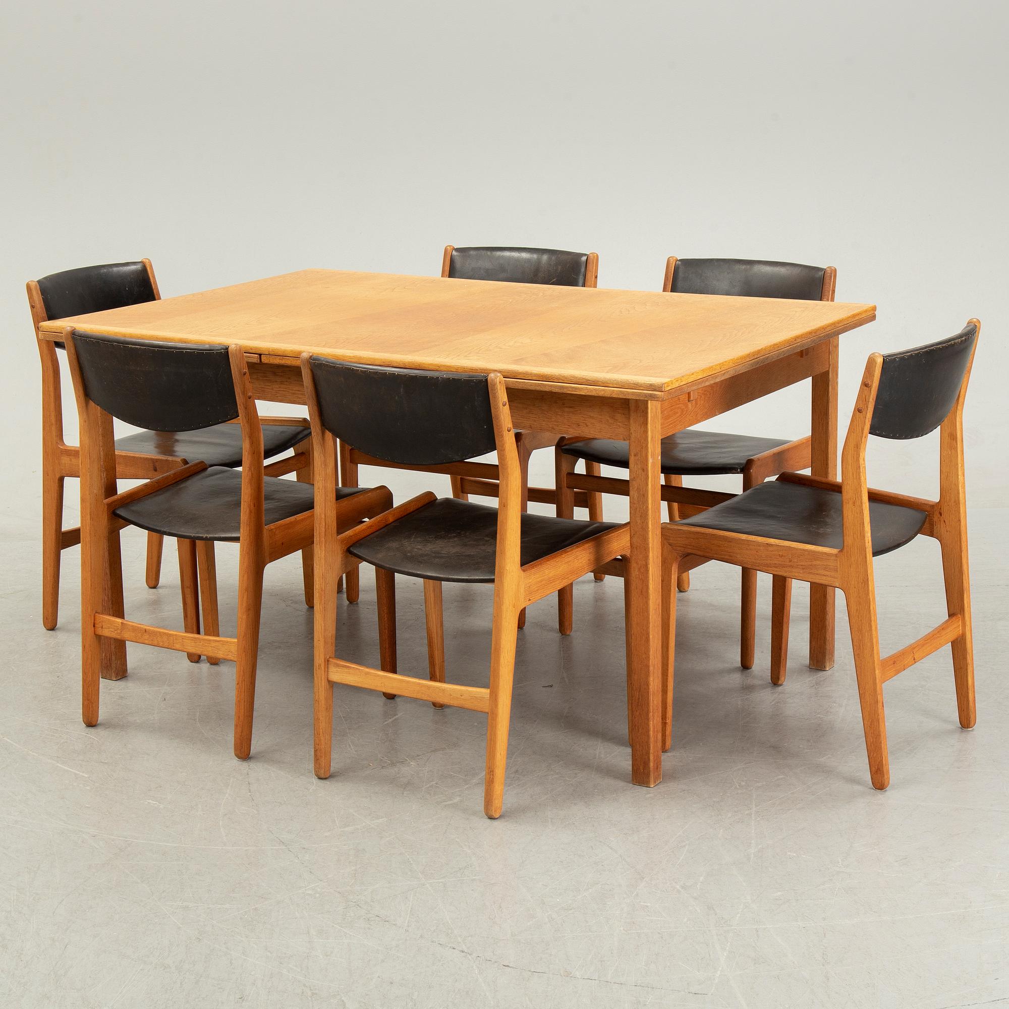 Knud Andersen, a set of six chairs for J.C.A Andersen, Aarhus, Denmark and a dinner table from Troeds, Bjärnum.