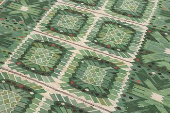 Barbro Nilsson, a carpet 'Nejlikan grön', flat weave, c. 390 x 278 cm, signed AB MMF BN.