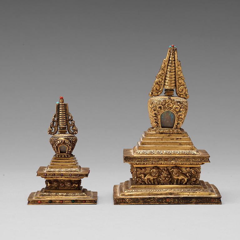 Two Tibetan gilt copper alloy stupa's, 19th Century.