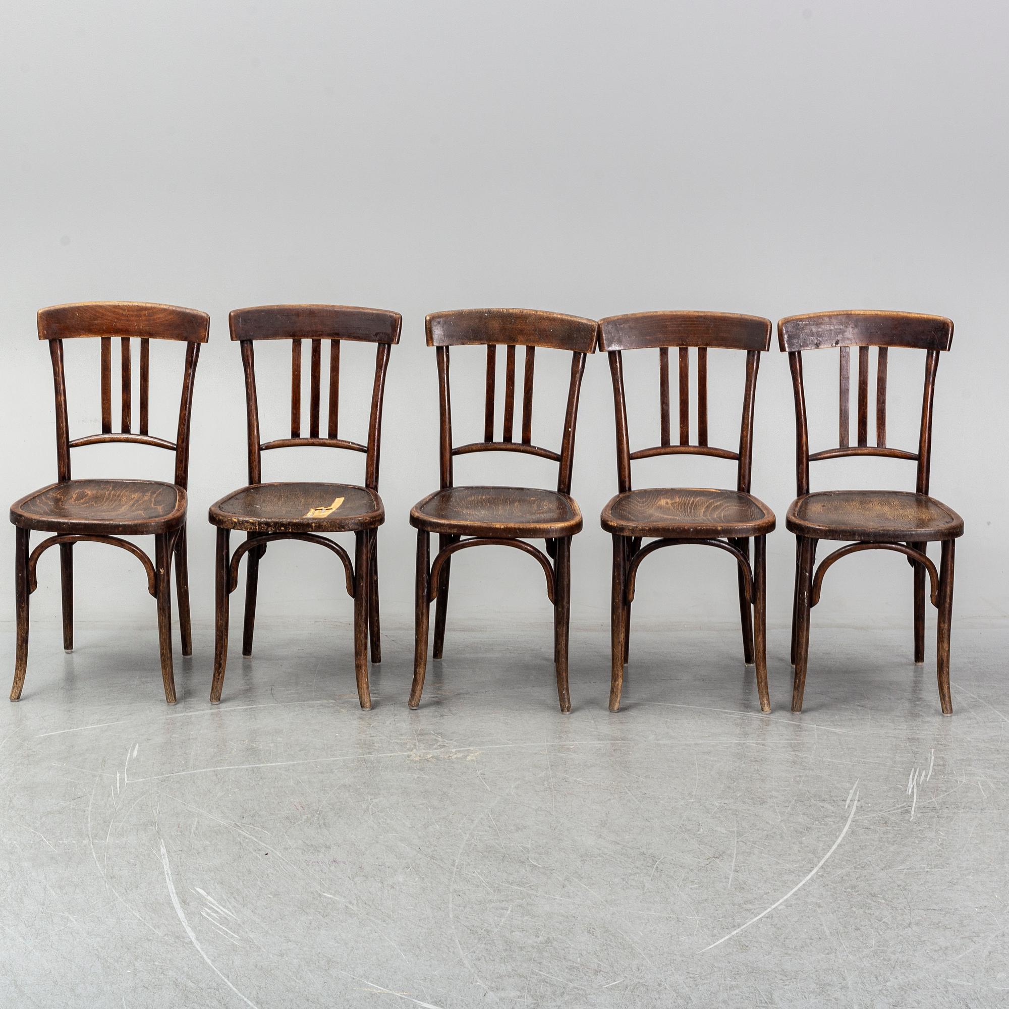 A matched set of four wooden chairs, first half of 20th Century.