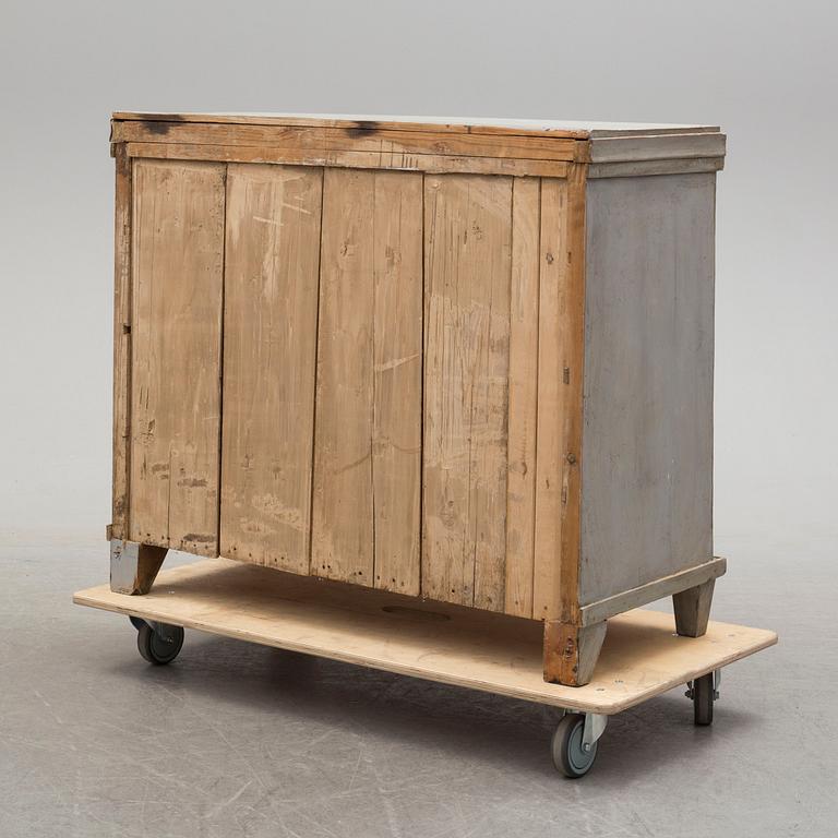 A mid 19th century painted chest of drawers.