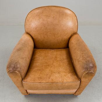 A brown leather armchair by grange, the second half of the 20th century.