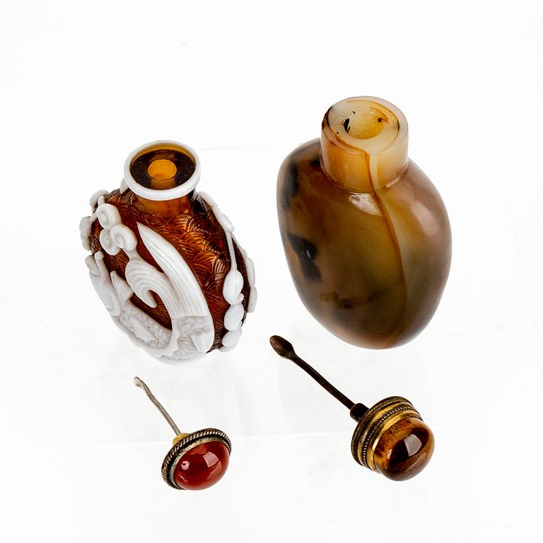 A set of two Chinese 20th century glass and agate snuff bottles.