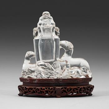 411. A rock crystal figural group with a vase and cover, presumably late Qing dynasty (1644-1912).