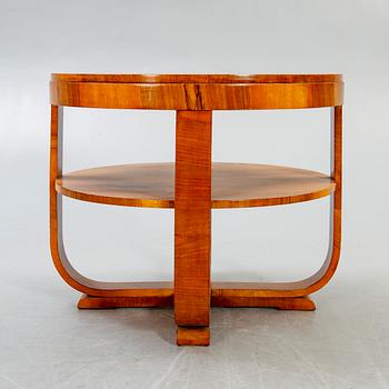 An Art deco style walnut coffee table alter part of the 19th century.